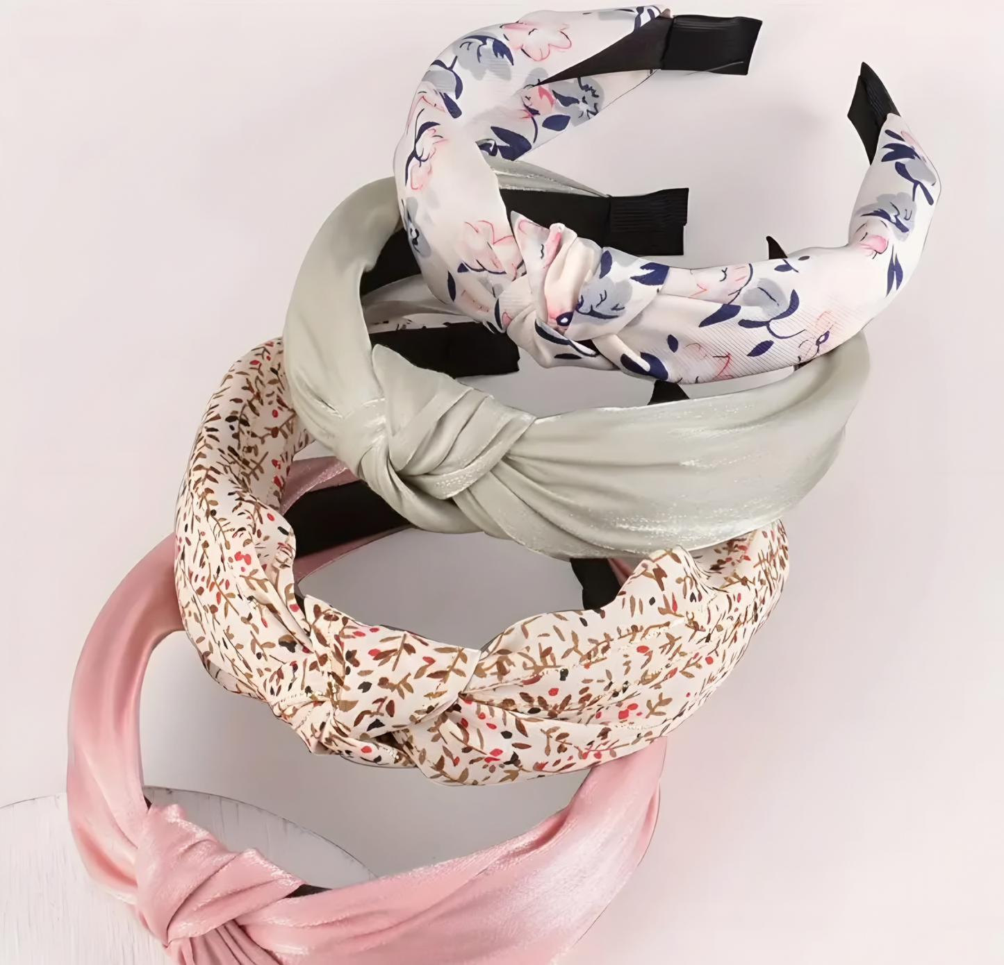 Set of colorful headbands on a light pink background