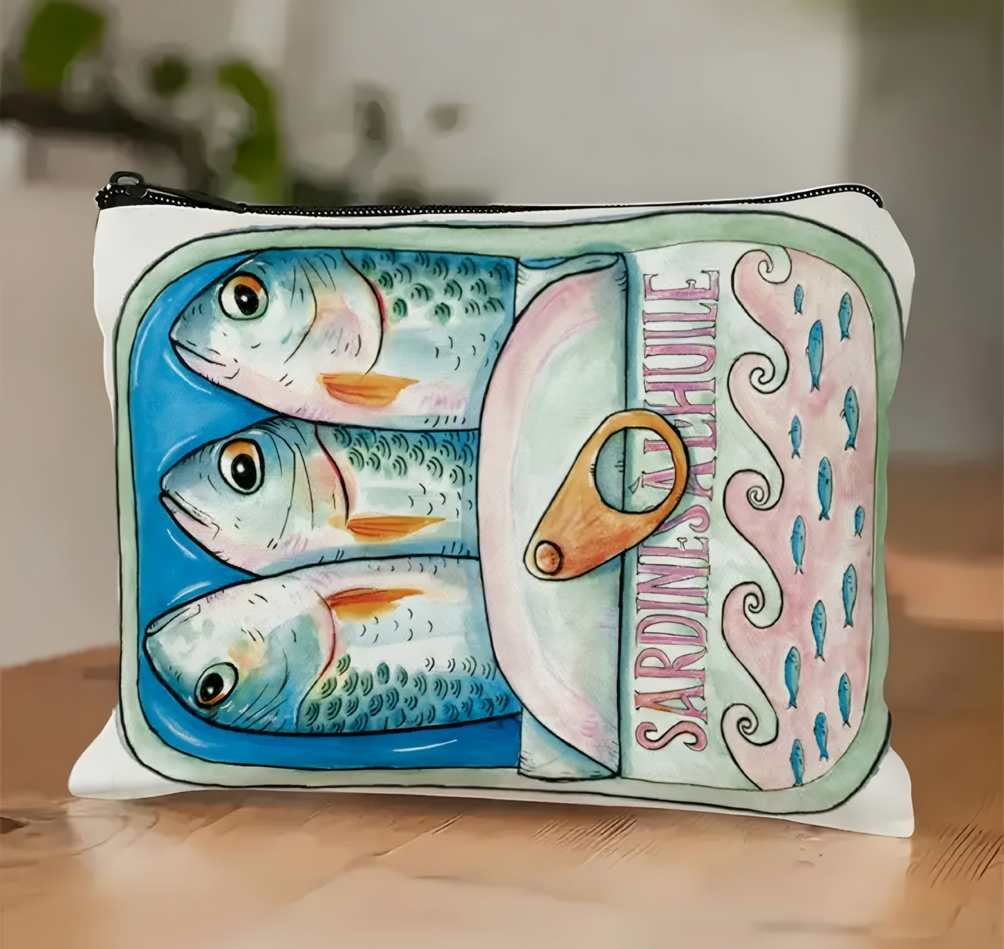 Pouch with sardine can design on a wooden surface