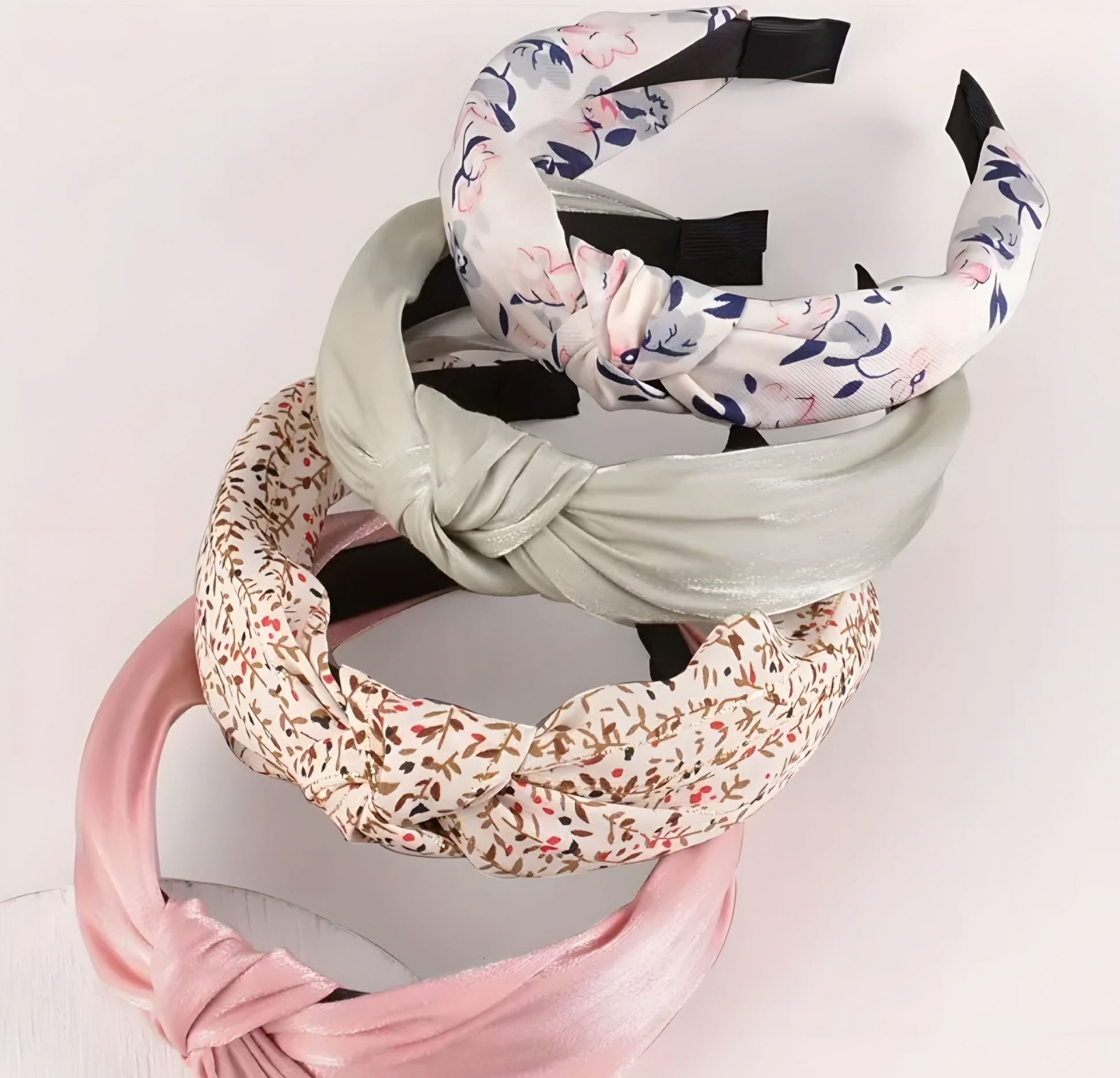Set of colorful headbands on a light pink background